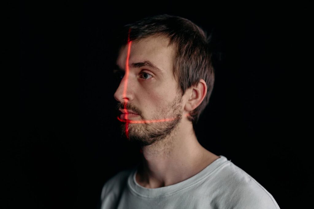 Facial recognition identity scan representing persistent AI identity, authorization, audit, and accountability.
